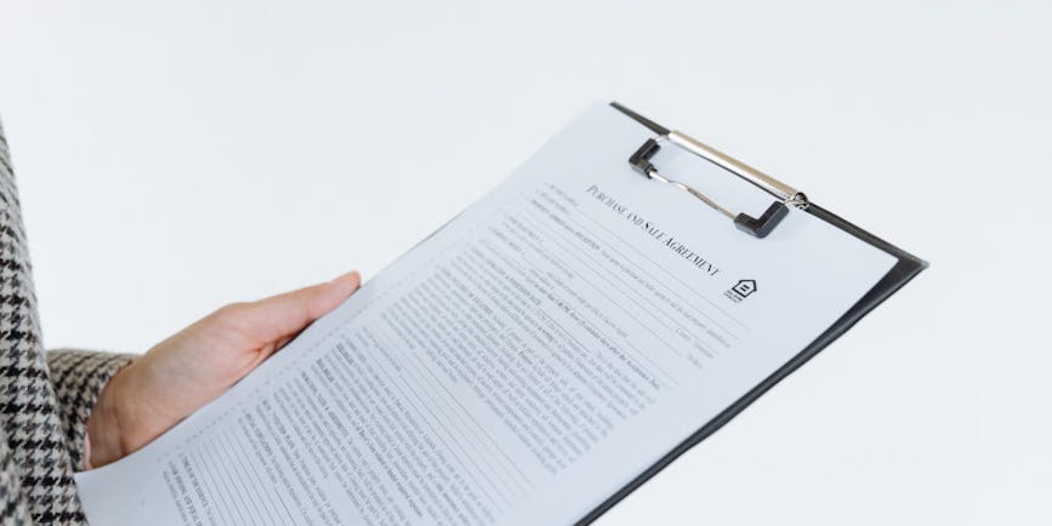 a contract on a clipboard